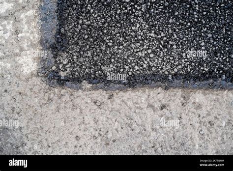 Tarmac pavement repair Stock Photo - Alamy