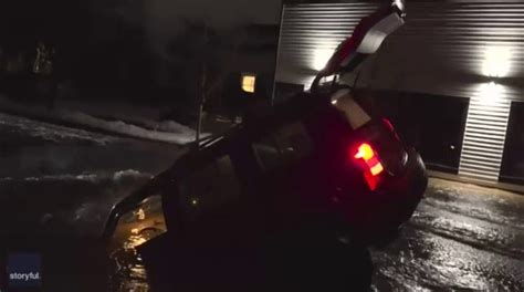 Couple Escapes From Car After It Plunges Into Sinkhole In Washington