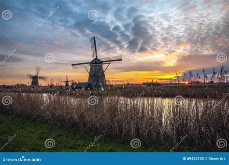 Windmills and Water Canal on Sunset in Kinderdijk, Holland Stock Photo - Image of mill, europe ...