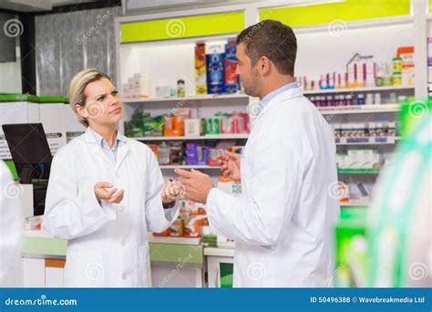 Team Of Pharmacist Talking Together Stock Photo Image Of Caucasian