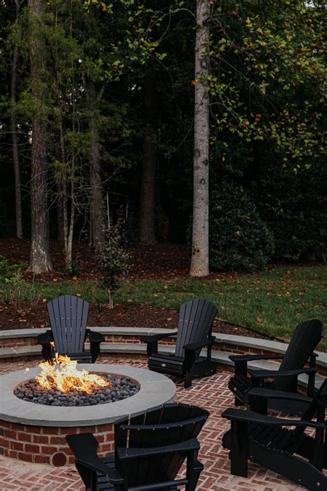 Our Sunken Fire Pit Paired With Black Adirondack Chairs