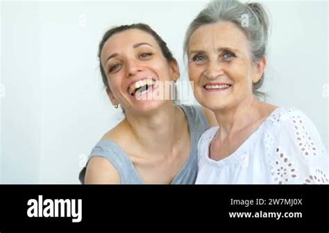 Happy Senior Mother Is Hugging Her Adult Daughter The Women Are