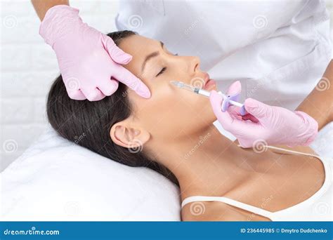 Cosmetologist Makes Rejuvenating Anti Wrinkle Injections On The Face Of