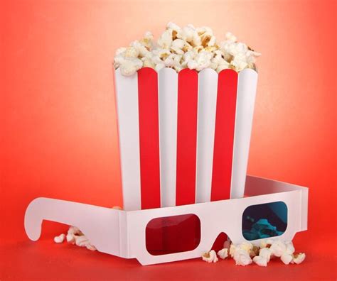 Premium Photo Popcorn And D Glasses On Red Background