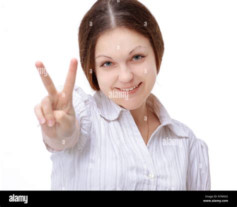 Closeup Smiling Young Woman Showing Victory Sign Isolated On White