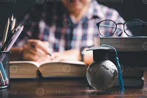 Graduation Cap With Earth Globe Concept Of Global Business Study