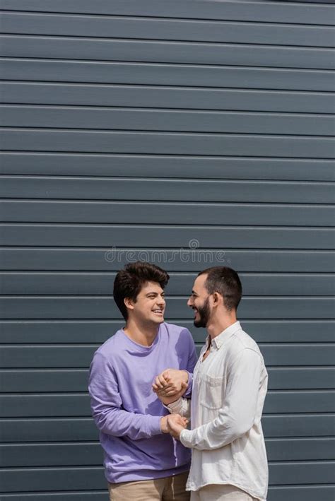 Cheerful Same Sex Couple Holding Hands Stock Image Image Of Lifestyle Boyfriends