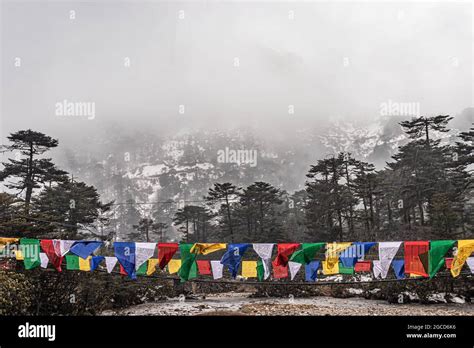 Snow Cap Mountains With Buddhist Prayer Flags At Morning Image Is Taken