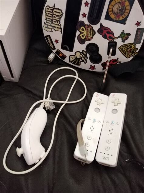 Nintendo Wii console with guitar hero guitar +two controllers + analog ...