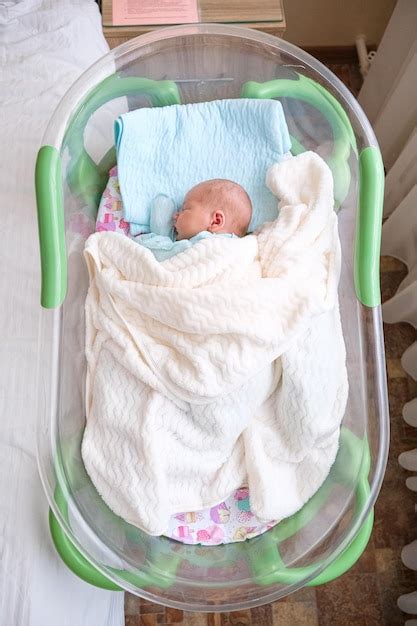 Premium Photo Newborn Baby Sleeping In Hospital Bassinet