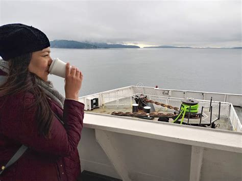 40 Year Old Latina Woman Drinks Coffee On A Ferry In Cold Weather Crosses The Border And Dreams