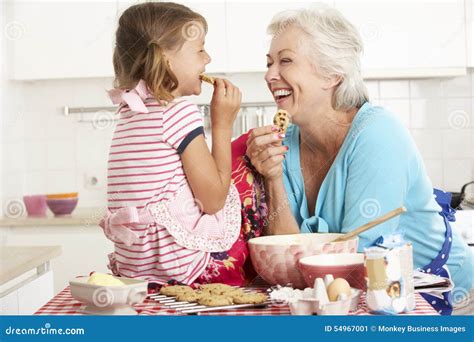 Grandmother And Granddaughter Baking In Kitchen Stock Image Image Of