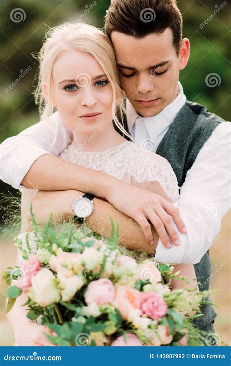 Stunning Portrait Of Bride And Groom Hug Each Other Tender Stock Photo