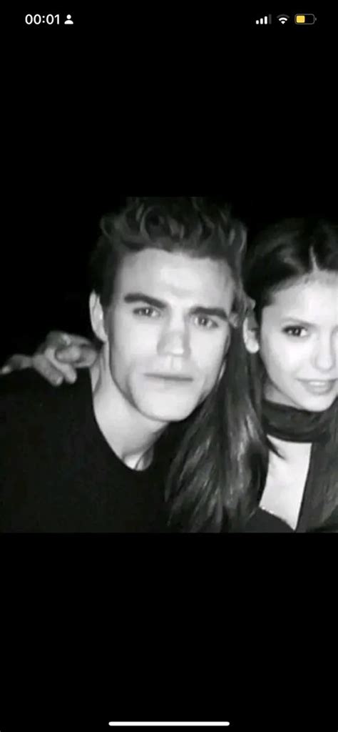 A Man And Woman Are Posing Together For A Photo In Black And White With