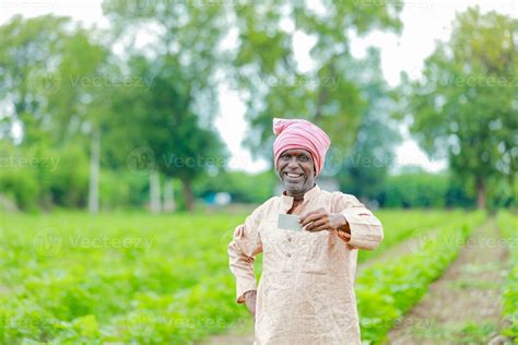 Indian farmer Holding gullak in hand, saving concept, happy poor farmer ...