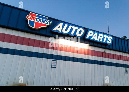 A logo sign outside of a Carquest Auto Parts retail store location in ...