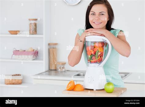 Brunette Posing With A Blender Stock Photo Alamy
