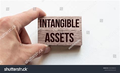 Hand Businessman Holding Wooden Blocks Conceptual Stock Photo