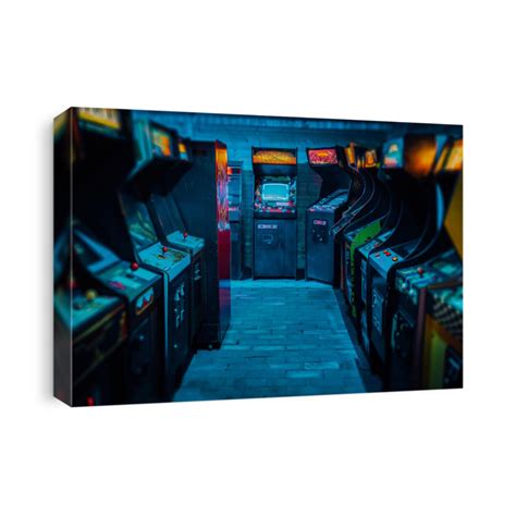 Old Vintage Arcade Video Games In An Empty Dark Gaming Room With Blue Canvas Print Canvasworld