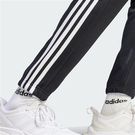 Adidas Essentials Fleece 3 Stripes Tapered Cuff Pants Black Adidas Uae