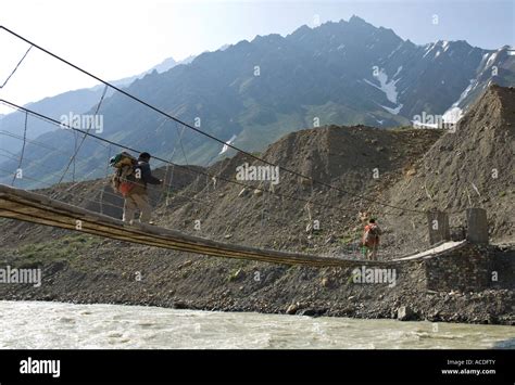 India Himachal Pradesh Spiti Pin Valley Mud Two Men Carrying Backpacks