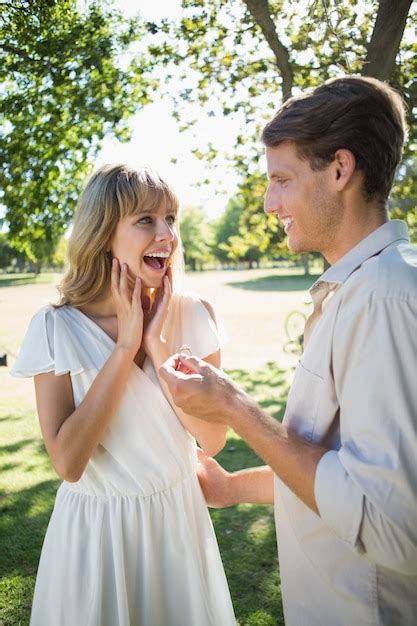 Premium Photo Man Surprising His Girlfriend With A Proposal In The Park