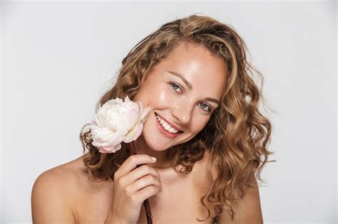 Premium Photo Pleased Half Naked Woman With Peony Smiling And Looking