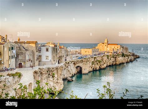 Vieste in Italy, an old Town on sea cliff and beaches: ancient houses and church Stock Photo - Alamy