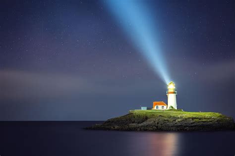 Premium Photo | Light beam of a lighthouse with copy spacein dark night