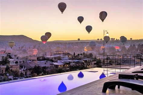 Cave Hotels With The Top View Of The Balloons In Cappadocia