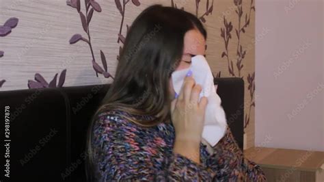 Sick Teenage Girl With Sore Throat Coughing And Blowing Her Nose Stock