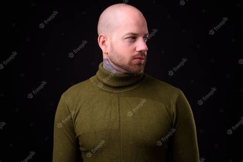 Premium Photo Handsome Bald Bearded Man Against Black Space