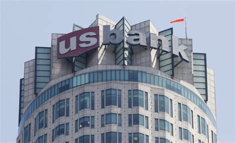 The Logo Of Us Bank Is Seen Atop The Us Bank Tower In Downtown Los