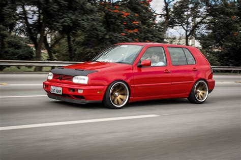 Red Volkswagen Golf Mk3 Driving Down The Street