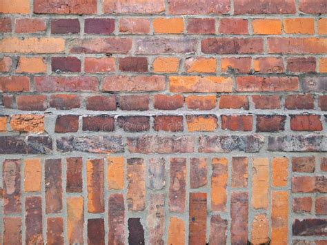 A Parede De Tijolo Velha Textura Velha Da Pedra Vermelha Obstrui O