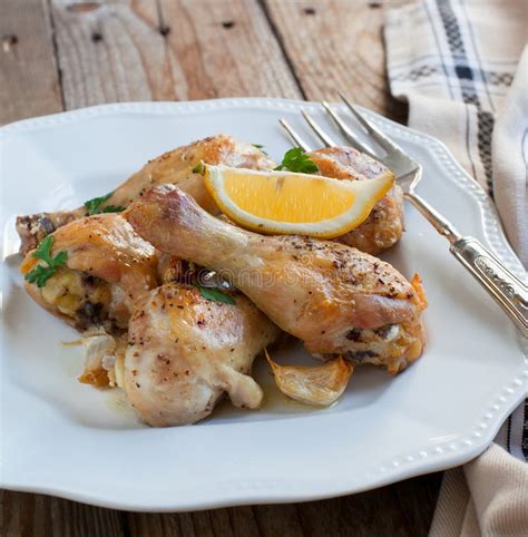 Roasted Chicken Legs With Lemon And Garlic Stock Image Image Of Fork