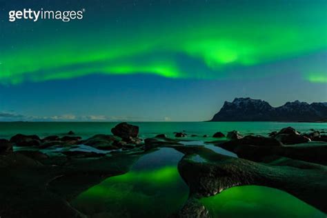 Northern Lights Aurora Borealis With The Dragon Eye In The Foreground