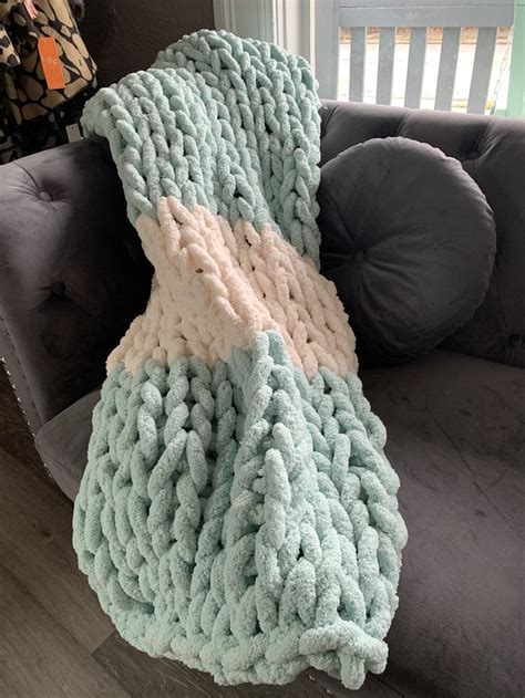 A Blanket That Is Sitting On Top Of A Couch