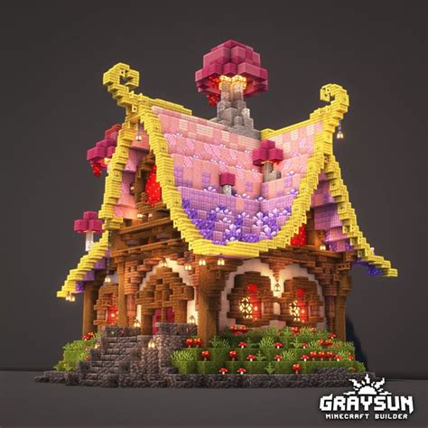 a house made out of legos is lit up at night with flowers and trees