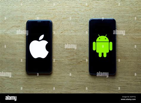 Apple and android smartphones. Iphone IOS versus Android operating system Stock Photo - Alamy