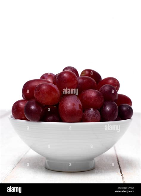 Red Grapes in a small bowl Stock Photo - Alamy