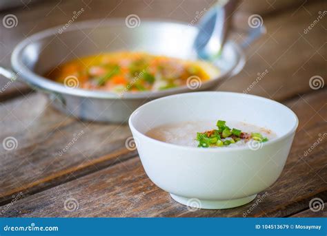 Rice Gruel and Panned Egg on Wooden Table Stock Image - Image of gruel ...