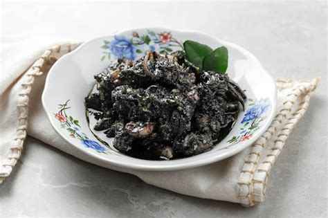 Premium Photo Tumis Cumi Hitam Or Stir Fry Squid In Black Ink Sauce