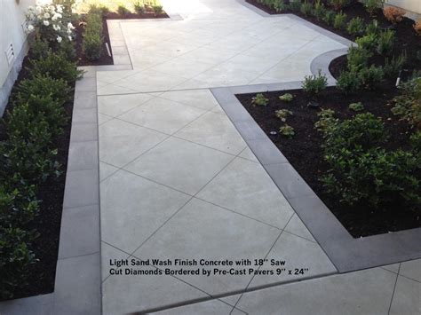 Light Sand Wash Finish Concrete With 18” Saw Cut Diamonds Bordered By