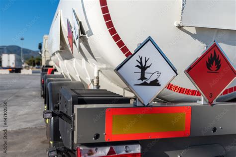 Tank Truck With Dangerous Goods With Labels Of Flammable And Pollutant