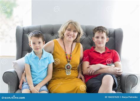 Mid Age Woman With Two Boys Indoor Stock Image Image Of Life Indoors