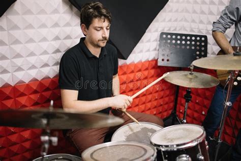 Portrait of Male Drummer Playing on Drum Set in Studio Stock Image ...