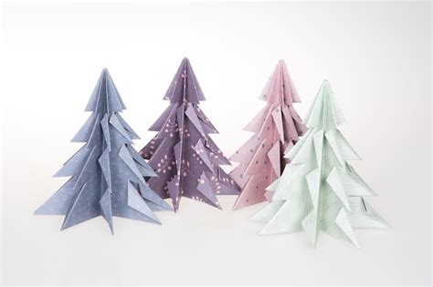 Premium Photo | Origami 3d xmas tree four from paper on white ...