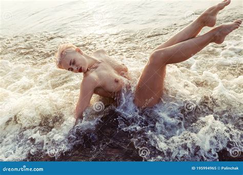 Naked Woman Playfully Lying On The Sea Shore Stock Image Image Of Lifestyle Beauty