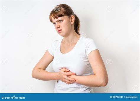 Woman With Stomach Pain Is Holding Her Aching Belly Stock Photo Image